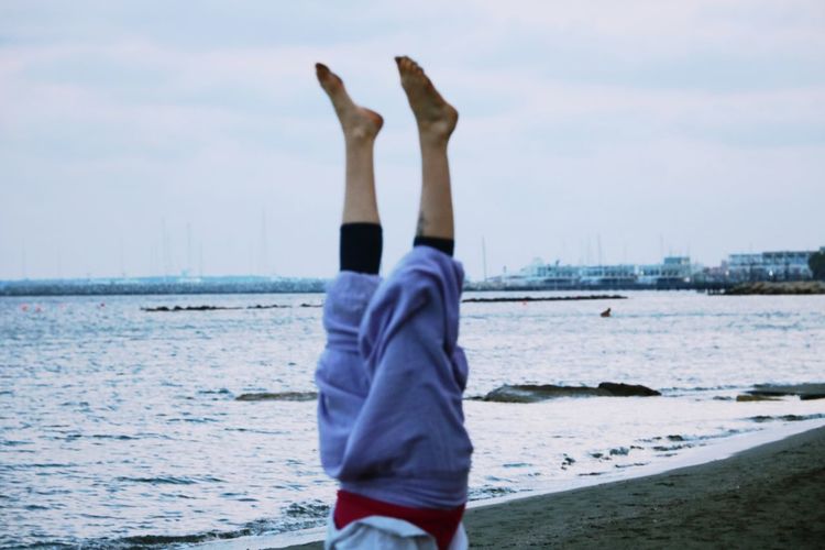 Feet in the air like you do not care, handstand, beach vibes