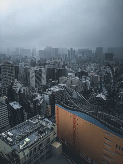 High angle view of buildings in city against sky