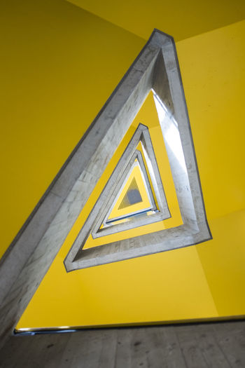 Close-up of yellow text on metal