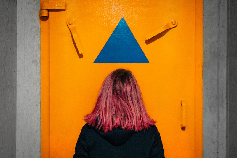The blue triangle on orange background is the symbol for a bomb shelter location