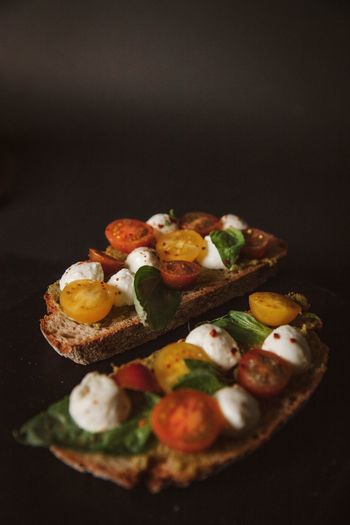 Close-up of ontre served on black background