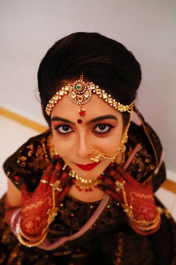 High angle portrait of beautiful bride wearing traditional clothing and jewelry