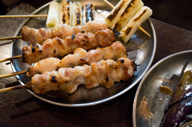 Close-up of chiken and long onion barbecue - japanese food yakitori and kushiyaki in izakaya