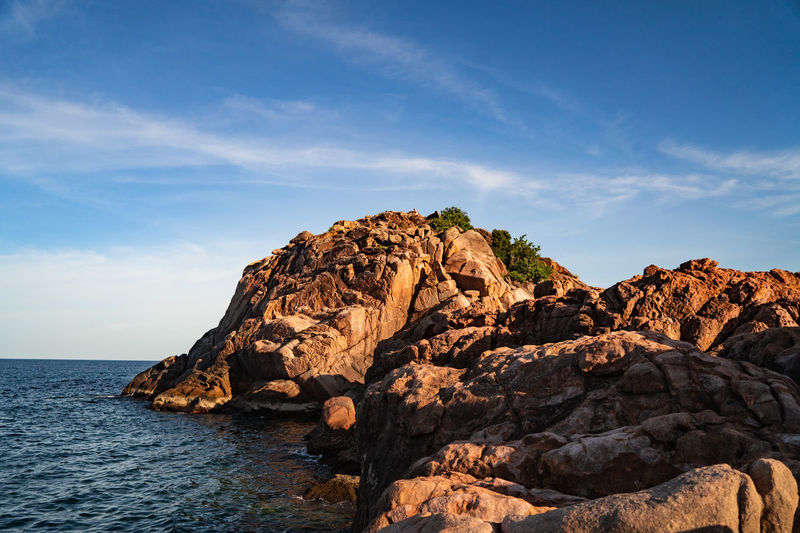 A tropical island with cliffs and perfect bly sky at long beach redang islands, malaysia