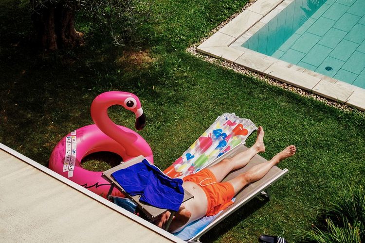 Man relaxing in swimming pool