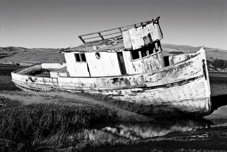 Abandoned boat in sea