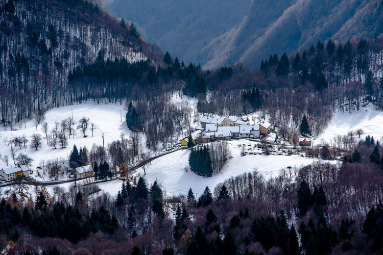 Now-covered houses in the venetian alps in tonezza, vicenza, italy