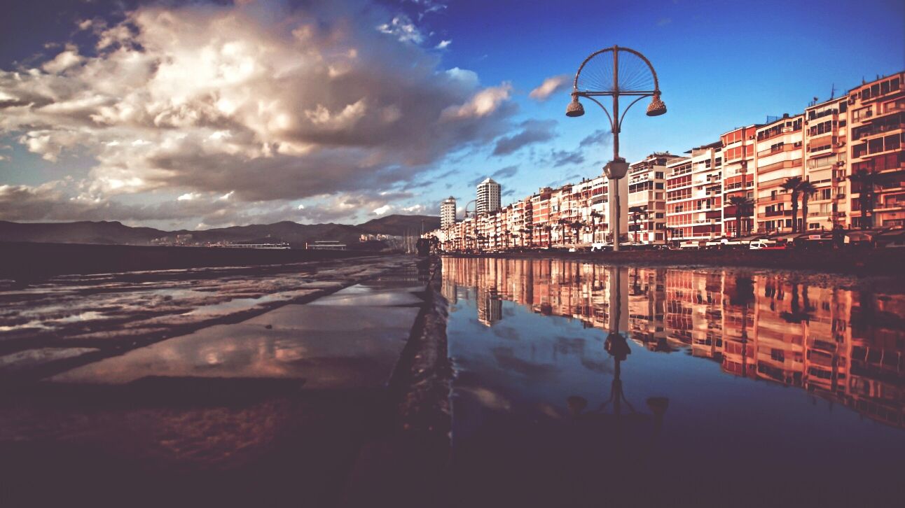 water, architecture, built structure, building exterior, sky, reflection, waterfront, cloud - sky, city, river, street light, dusk, cloud, transportation, canal, outdoors, railing, bridge - man made structure, no people, connection
