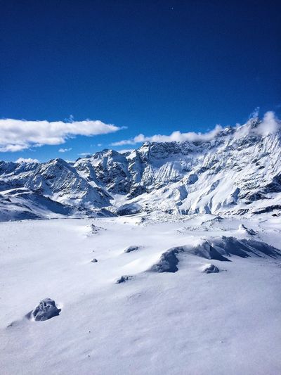 Scenic view of snow covered mountains