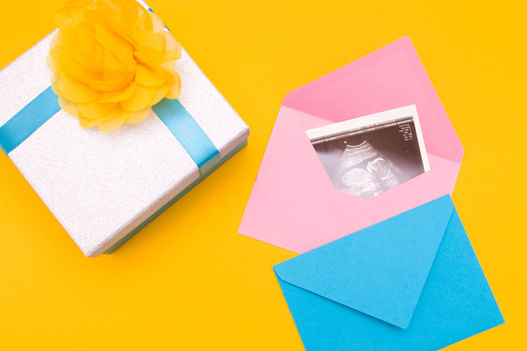 Close-up of ultrasound photograph in box over colored background