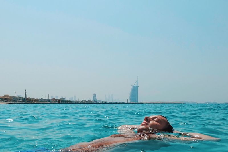 Scenic view of sea against clear blue sky