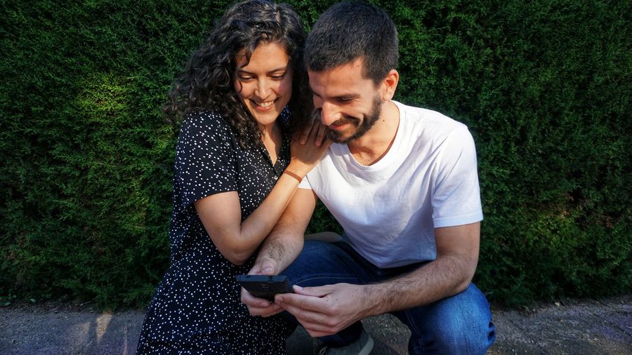 Young couple using mobile phone