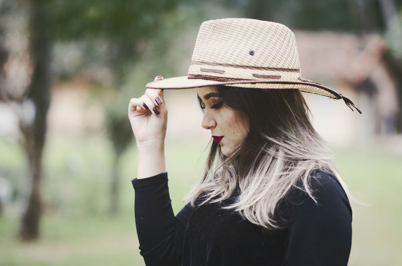 Portrait of beautiful woman wearing hat