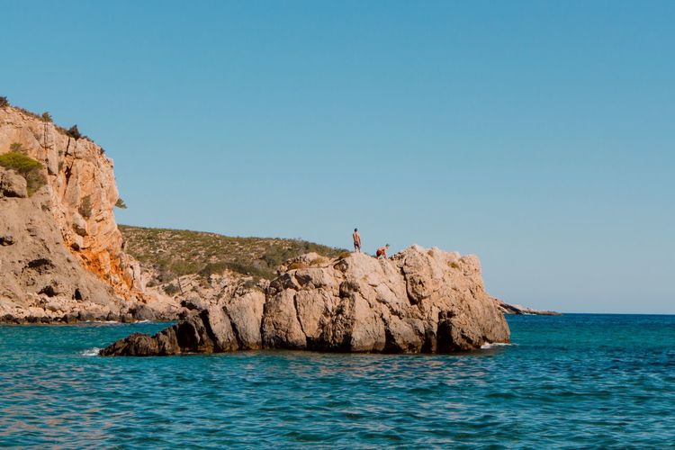 Scenic view of sea against clear blue sky