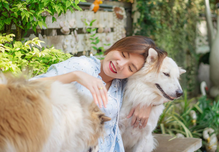 Side view of a woman with dog