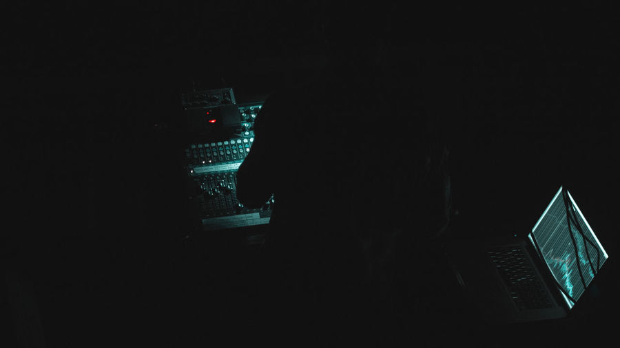 Illuminated telephone booth at night