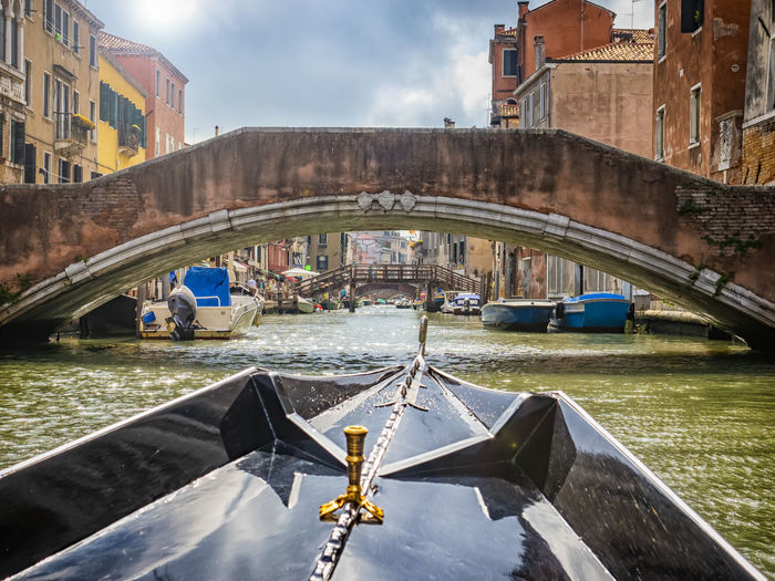 Gondola tour in a canal of venice