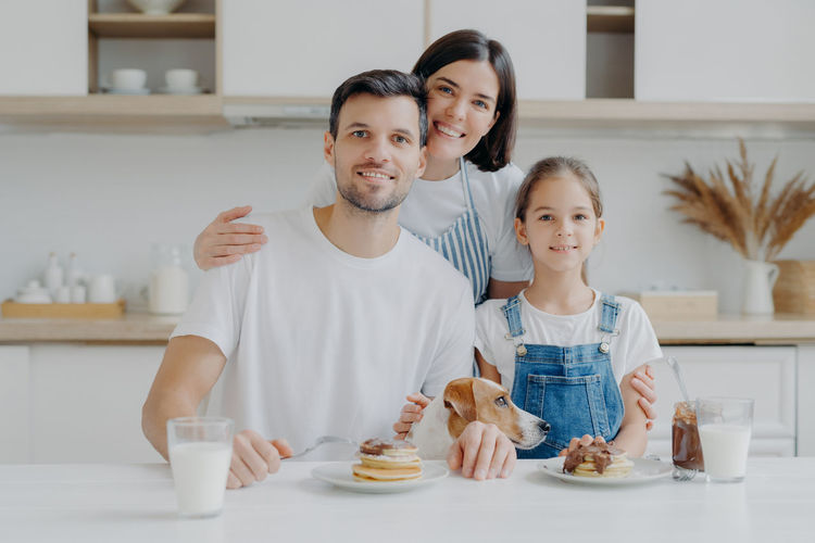 Portrait of smiling girl on table