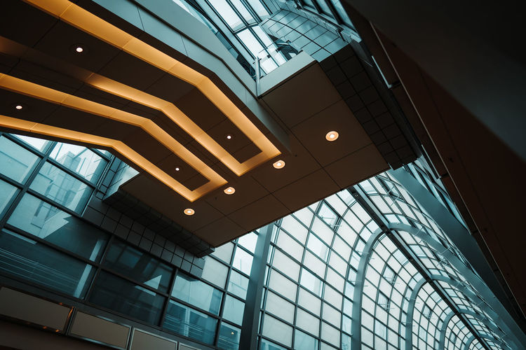 Low angle view of ceiling and escalators in modern building