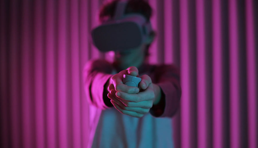 Boy wearing virtual reality simulator