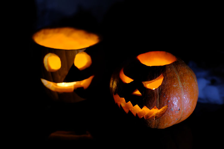 Close-up of illuminated pumpkin against black background