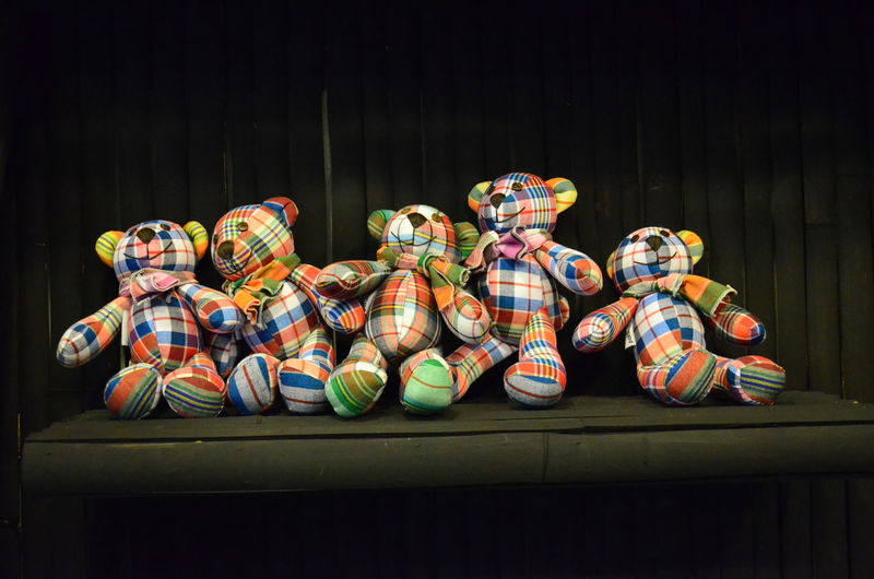 Close-up of colorful teddy bears on table