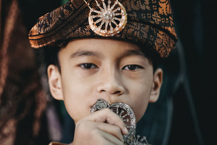Close-up portrait of boy wearing turban