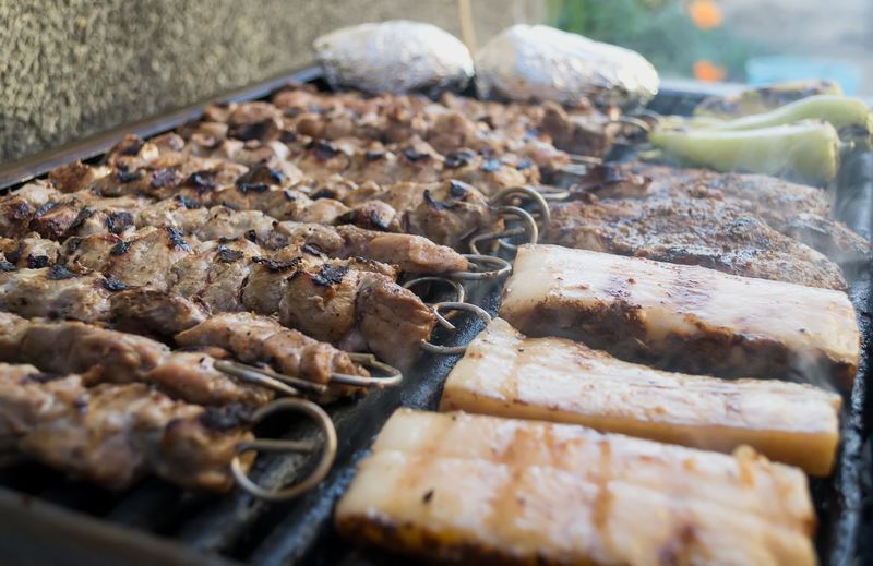 Juicy slices of meat, bacon, toast and peppers - grilled