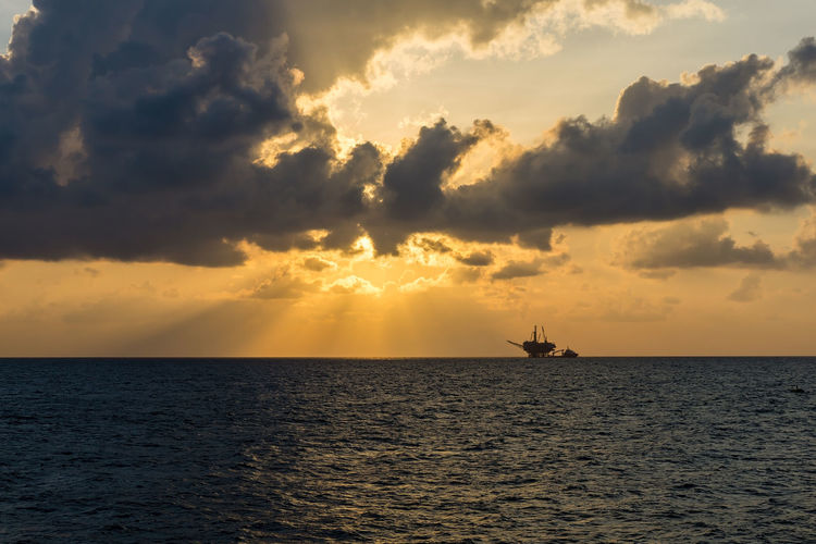 Oil production platform complex during sunrise at terengganu oil field