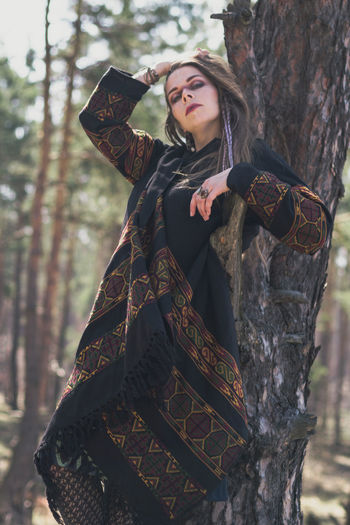 Languid woman in ethnic clothes scenic photography