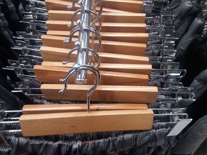 Close-up of clothes on hangers in store