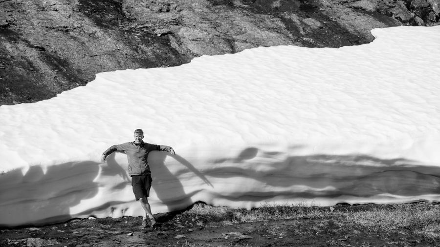 Man standing against glacier