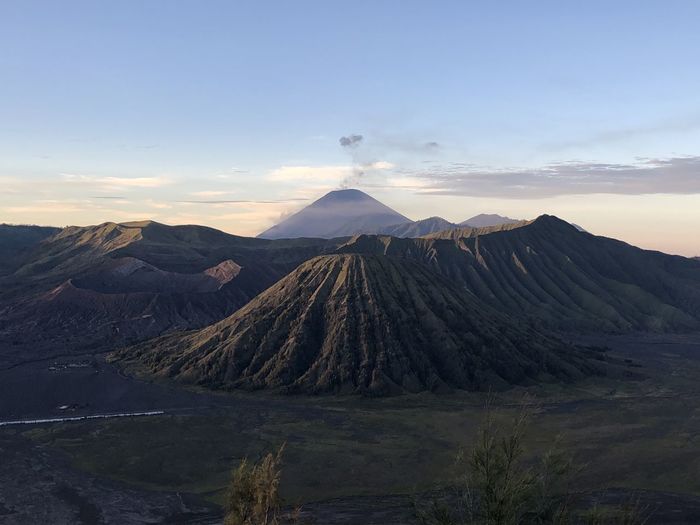 Panoramic view of volcanic mountain range against sky