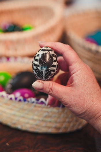 Cropped hand of woman holding easter egg
