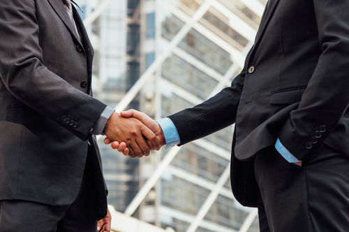 Cropped image of businessmen shaking hands
