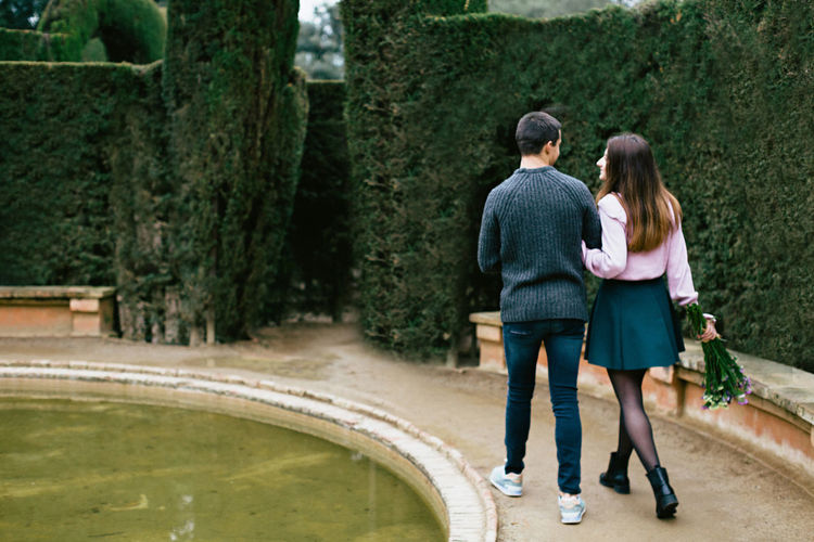 Rear view of couple walking outdoors