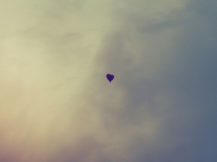 Hot air balloon against cloudy sky