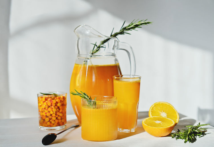Orange juice in glass on table