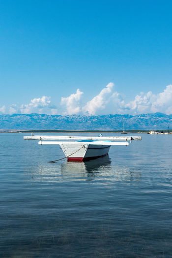 Boat in sea against sky