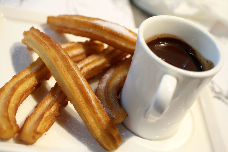 Churros with hot chocolate, a specialty of spanish pastry 