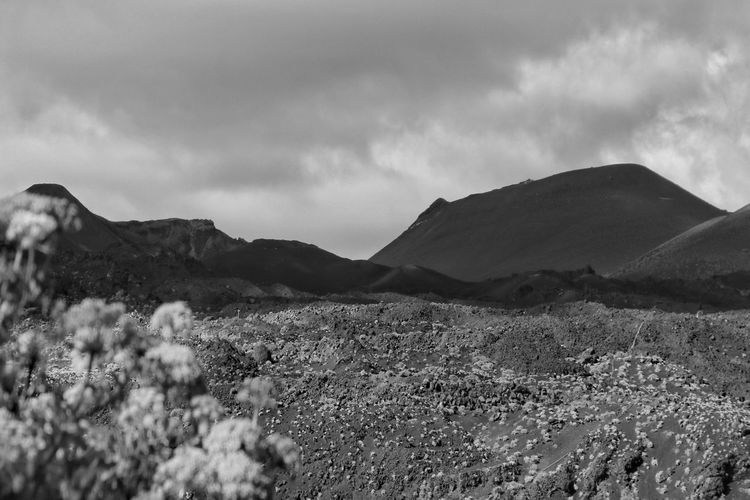 Scenic view of volcanic mountains against sky