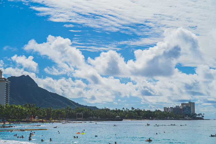 Oahu, hawaii november 15 2019 tourists enjoying waikiki beach with diamond head in background