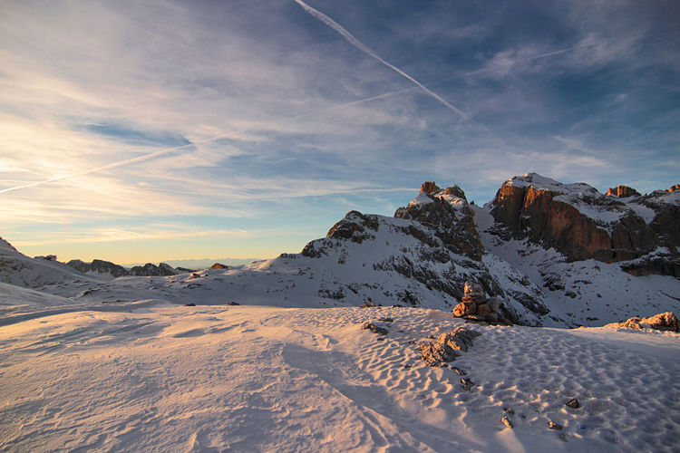 Pale di san martino. unesco italy. scenic view of snowcapped dolomites against sky during sunset.