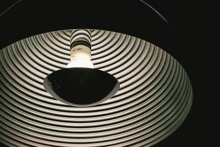 Low angle view of illuminated electric lamp