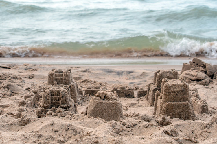 A village of sand castles in left abandoned on the shores of lake michigan in michigan usa