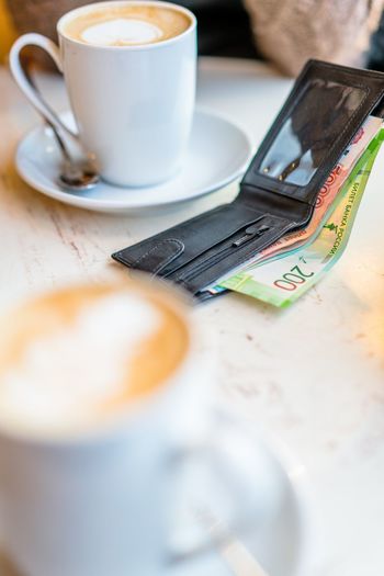 Close-up of russian currency roubles in wallet on table in cafe. money in wallet