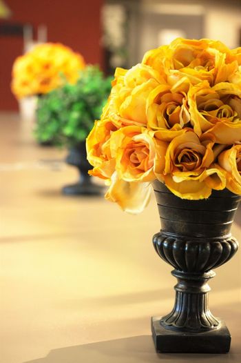 Yellow roses in urns at home