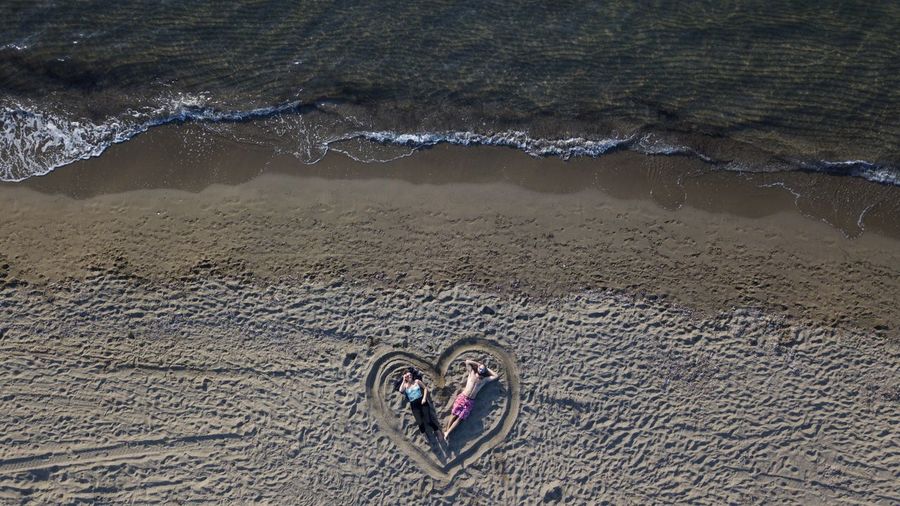 High angle view of man and woman on beach