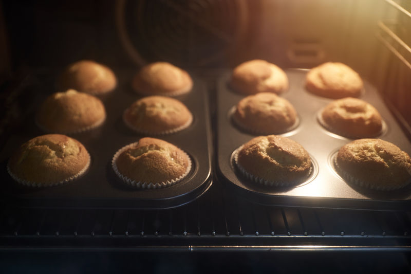 Group of cupcakes inside the oven. concept of sweets.