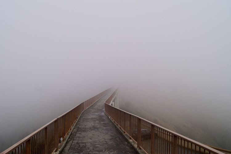 Bridge suspended in the fog  civita di bagnoregio italy